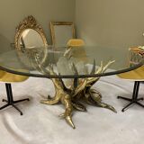 Round glass and brass table by designers Richard and Isabelle Faure