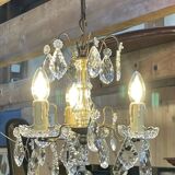Three-light chandelier in bronze and cut crystal, early 20th century work.