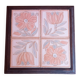 Ceramic tile trivet with floral patterns in pastel tones.