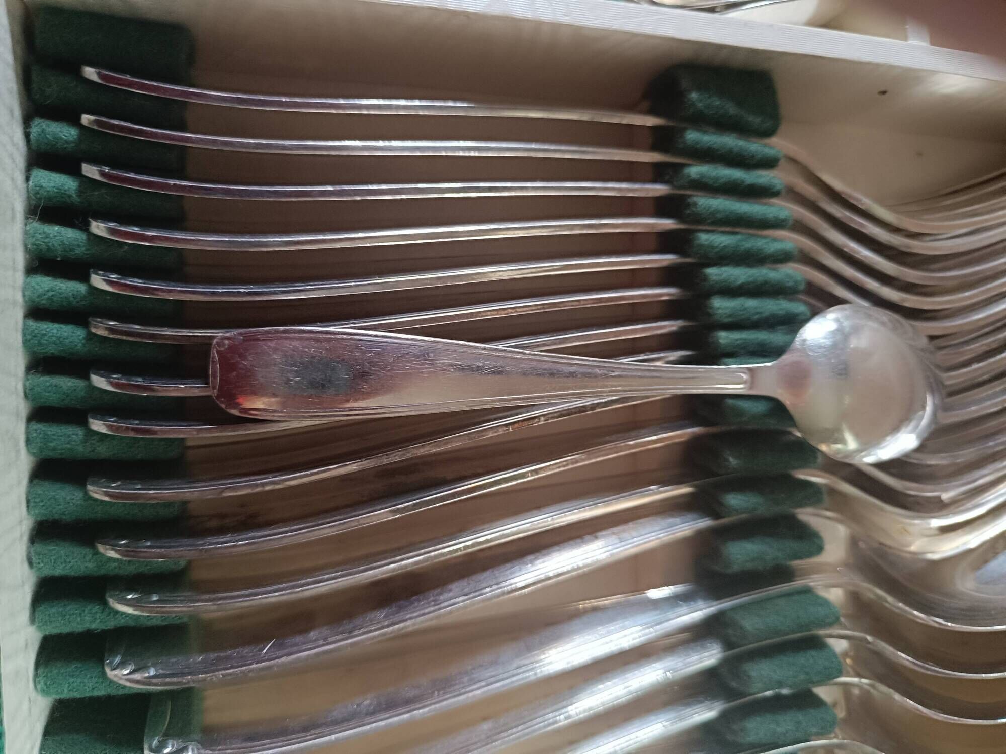 Silver metal cutlery. 12 spoons+12 forks+12 teaspoons+ladle. In box.