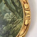 Cadre ovale en bois sculpté doré