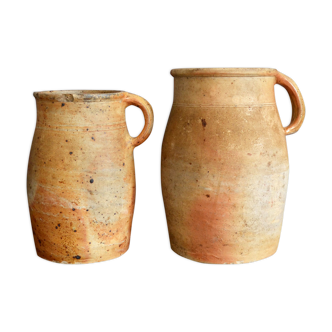 two jugs - old pots in matt sandstone