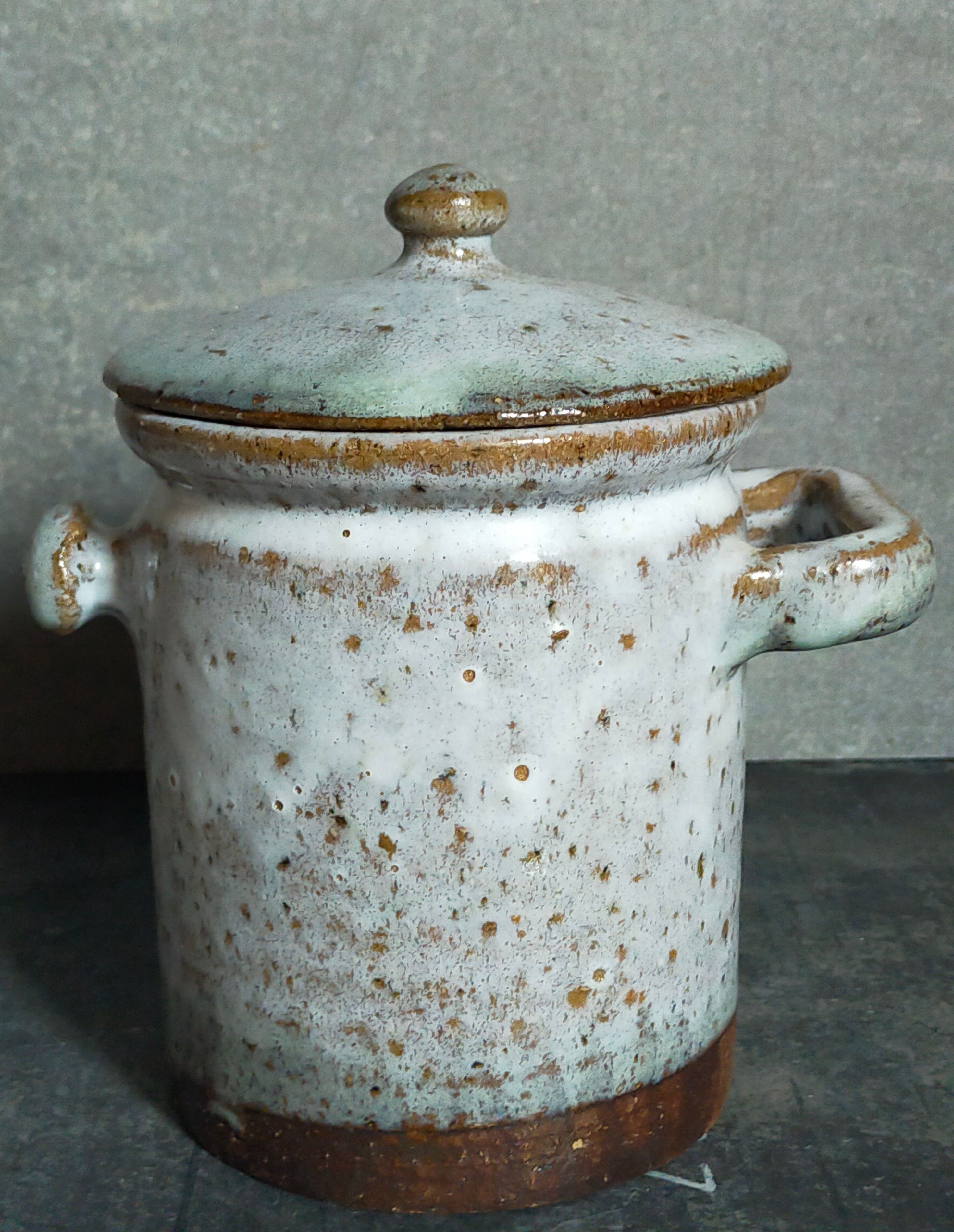 Duo of potter's pots covered in vintage glazed stoneware