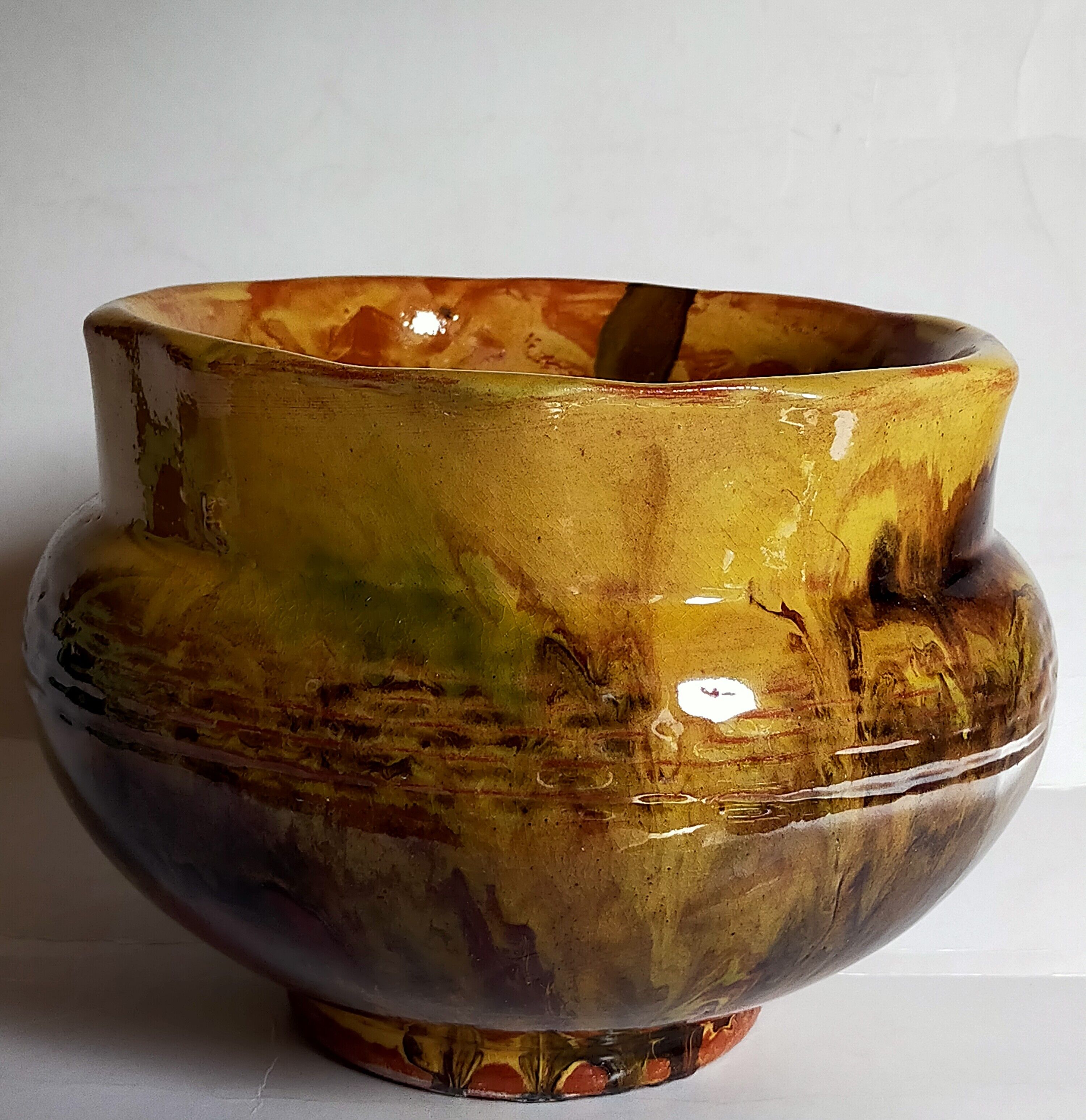 Old provencal pot cover in glazed terracotta