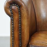 Club chair made of sheepskin leather with the most beautiful colors and a stunning patina