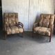 Pair of Art Deco armchairs from the 1930s in brown fabric and carved wood — vintage style