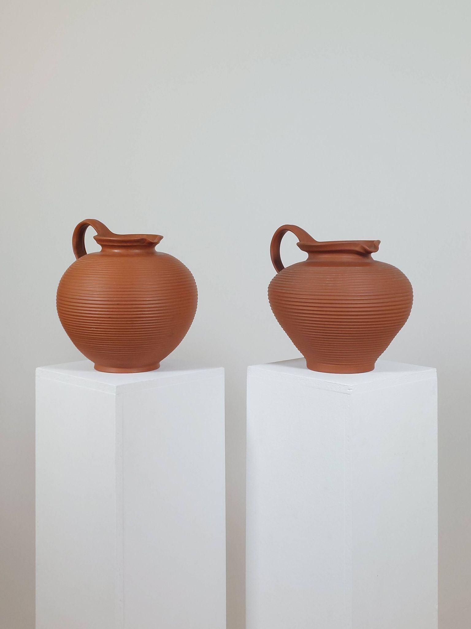 Pair of handcrafted terracotta vases from the mid-century.