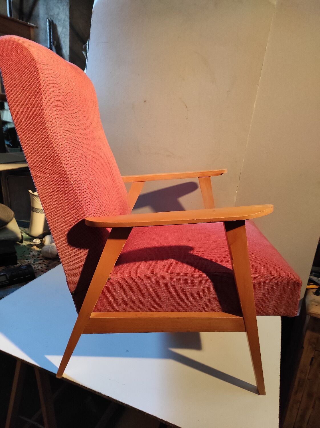 Vintage red armchair with compass feet in Scandinavian design