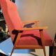 Vintage red armchair with compass feet in Scandinavian design