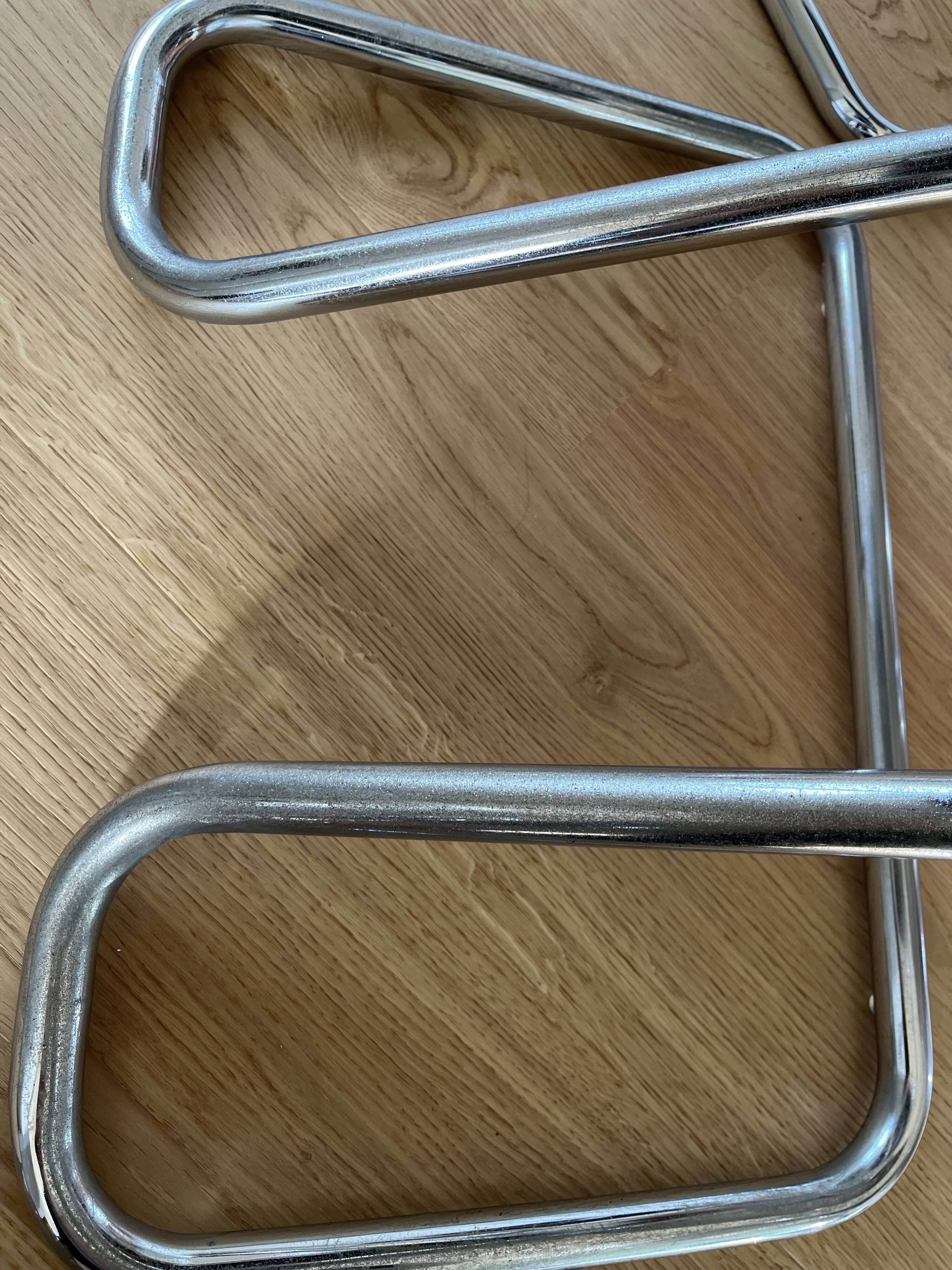 1970s chairs in acrylic and metal designed by Harvey Guzzini.