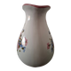 Old ceramic pitcher with floral decoration.