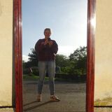 Large antique mirror in a flame mahogany frame; 132x82 cm