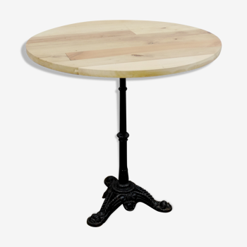 Wooden bistro table and cast foot