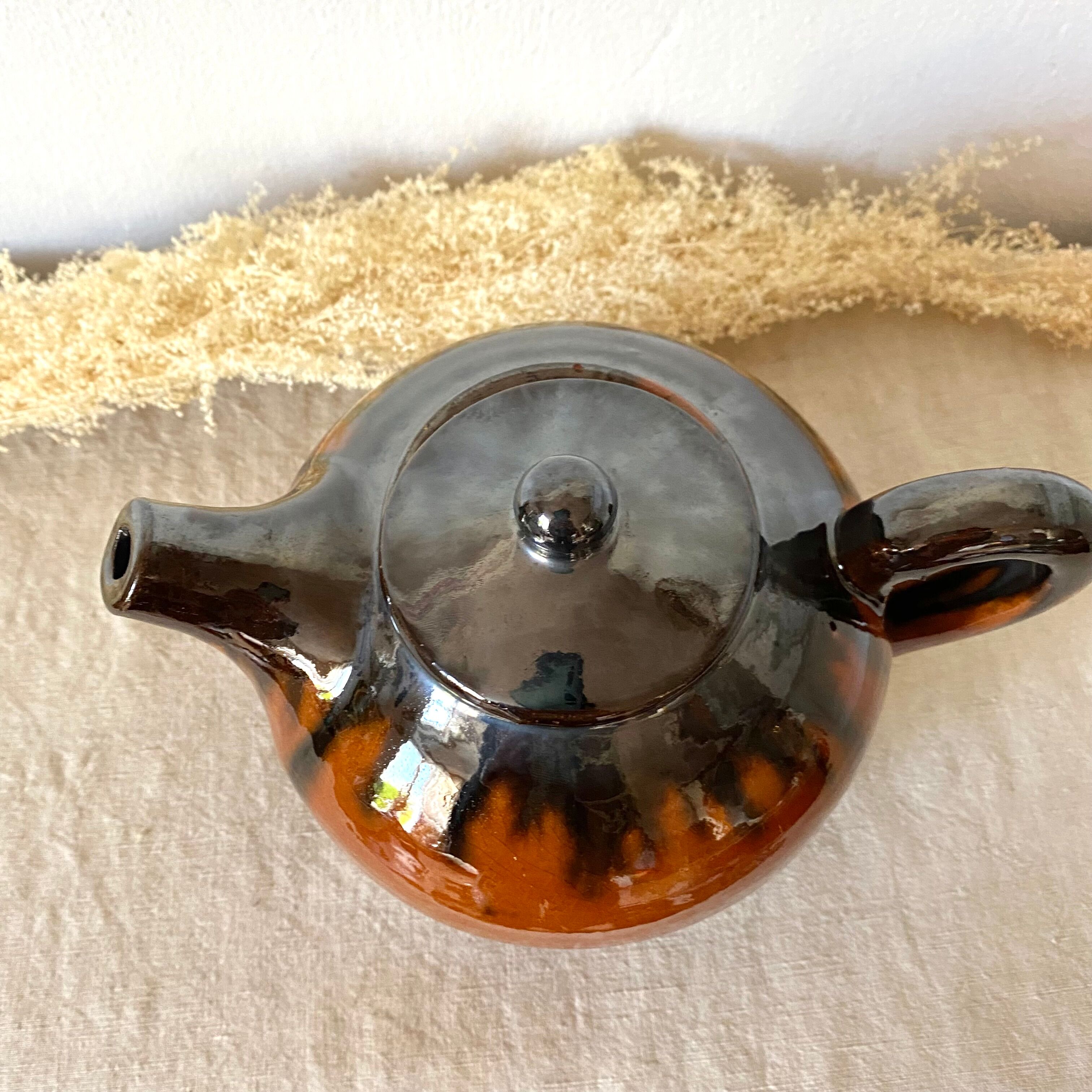 Glazed terracotta teapot