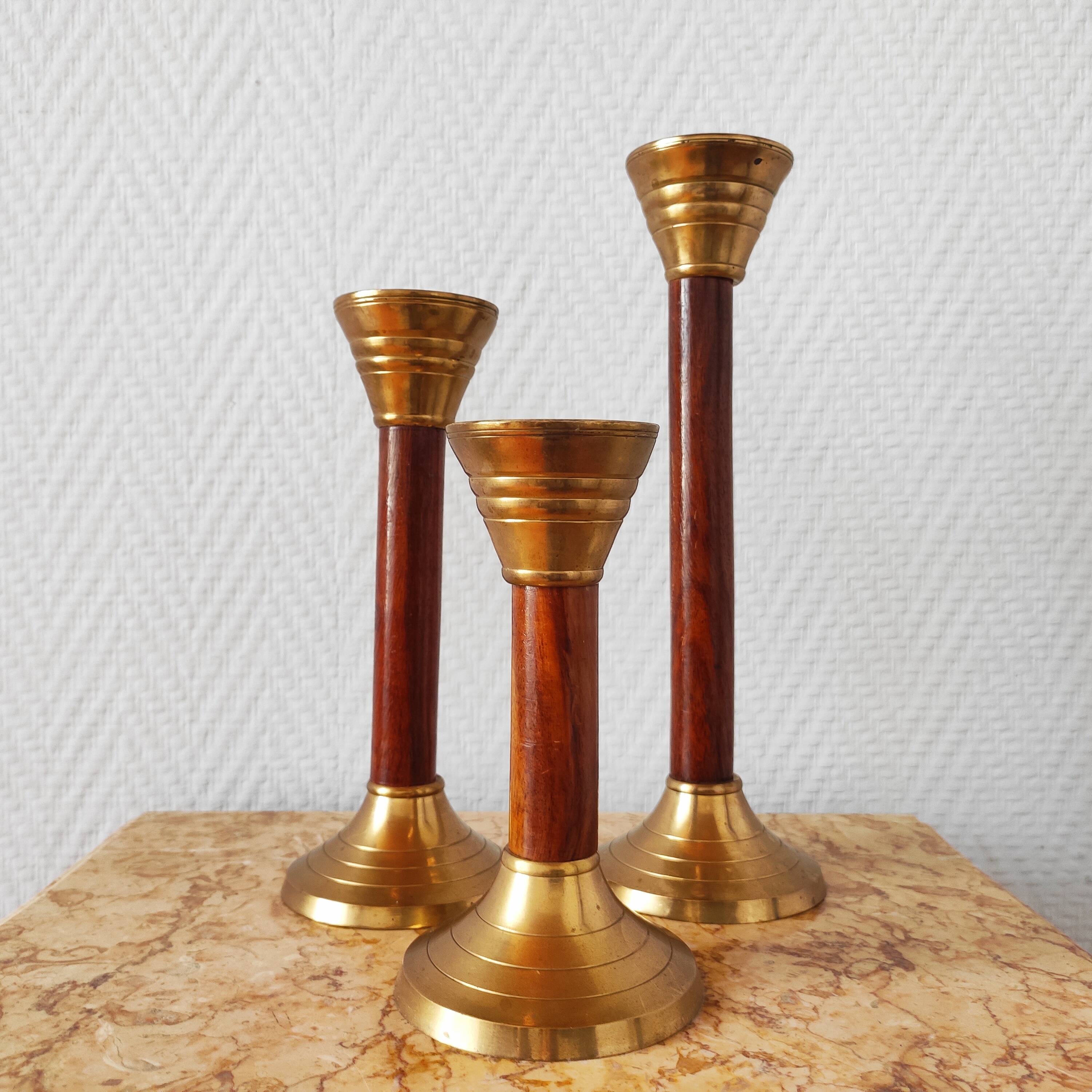 Set of three vintage wooden and brass candlesticks