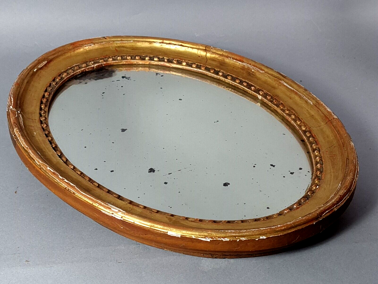 Oval mirror carved wood frame beaded gilded circa 1800 44x35cm SB