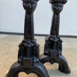 Pair of cast iron chenets with stylized faces High Epoch SEVENTEENTH century