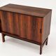 Low sideboard in rosewood with sliding doors. Denmark, 1960s