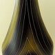 Earthenware vase decorated with yellow lines on a black and yellow background