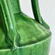 Pottery green ceramic vase with four handles.
