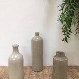 Trio of old sandstone bottles and jars