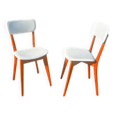 vintage wooden chairs with white faux leather