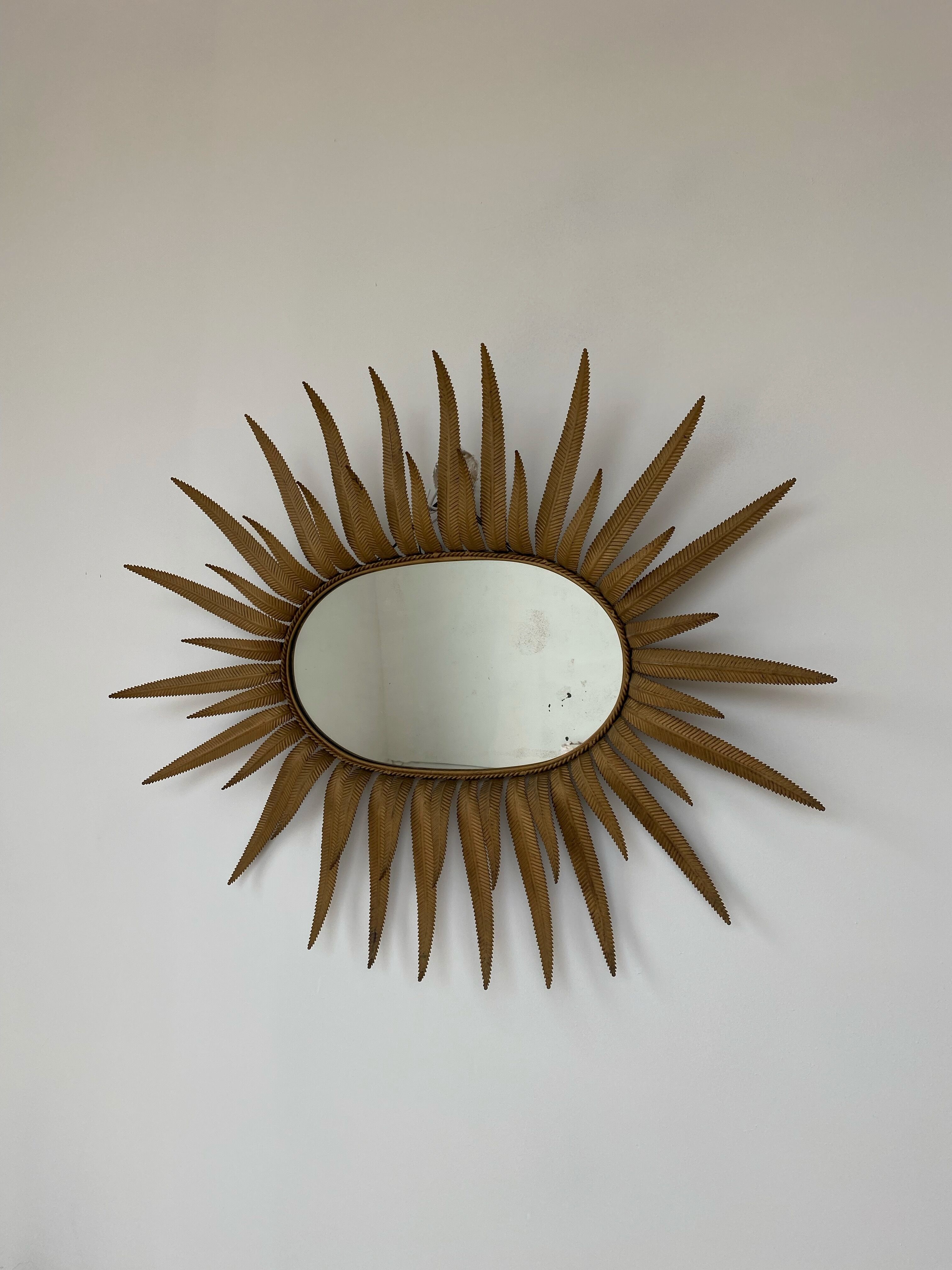 Vintage copper metal sun mirror oval shaped from the 1960s