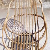 Antique swivel rattan armchair