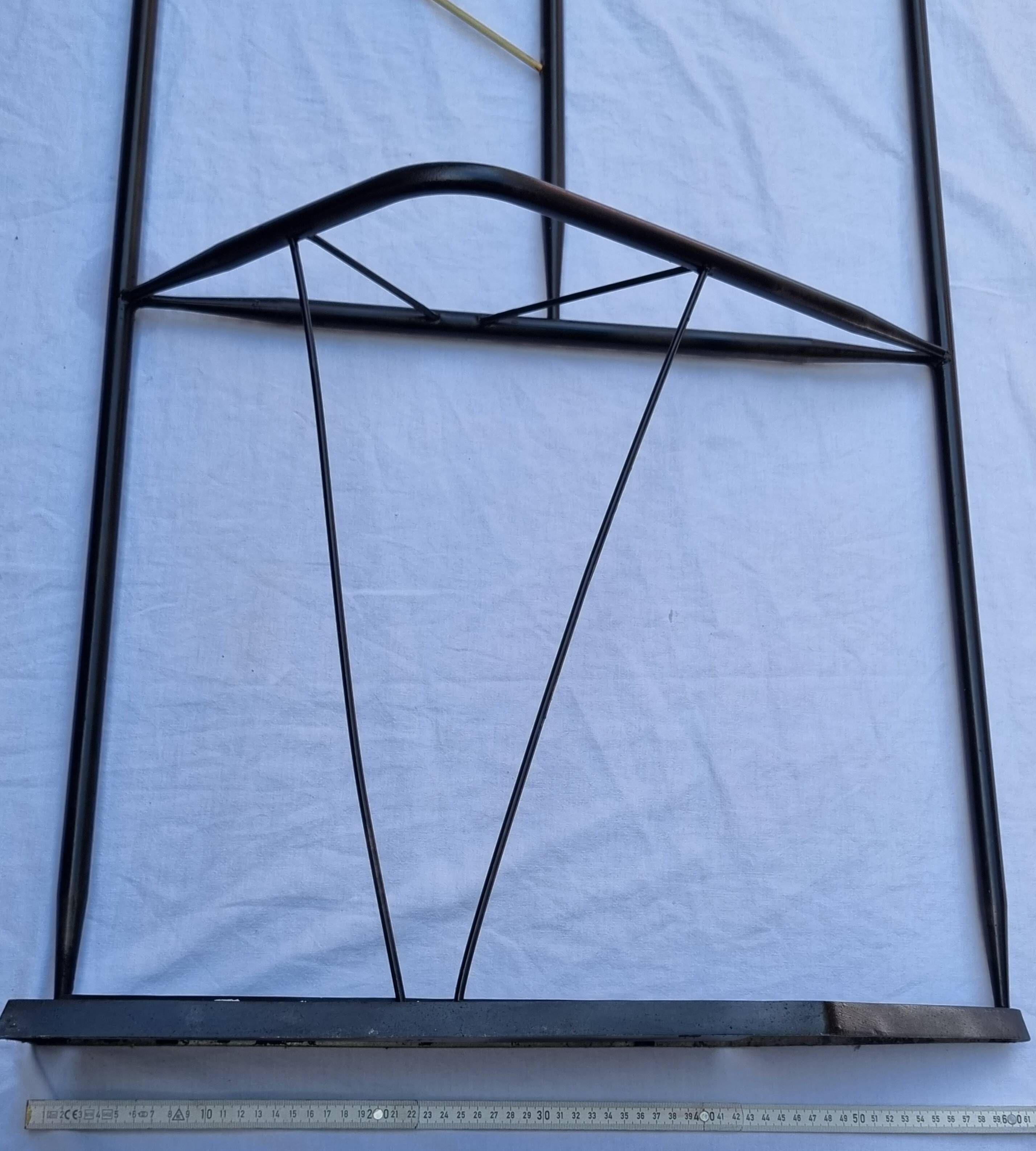 Postmodern entrance wardrobe from the 1980s in black metal and Bakelite, 180 cm.