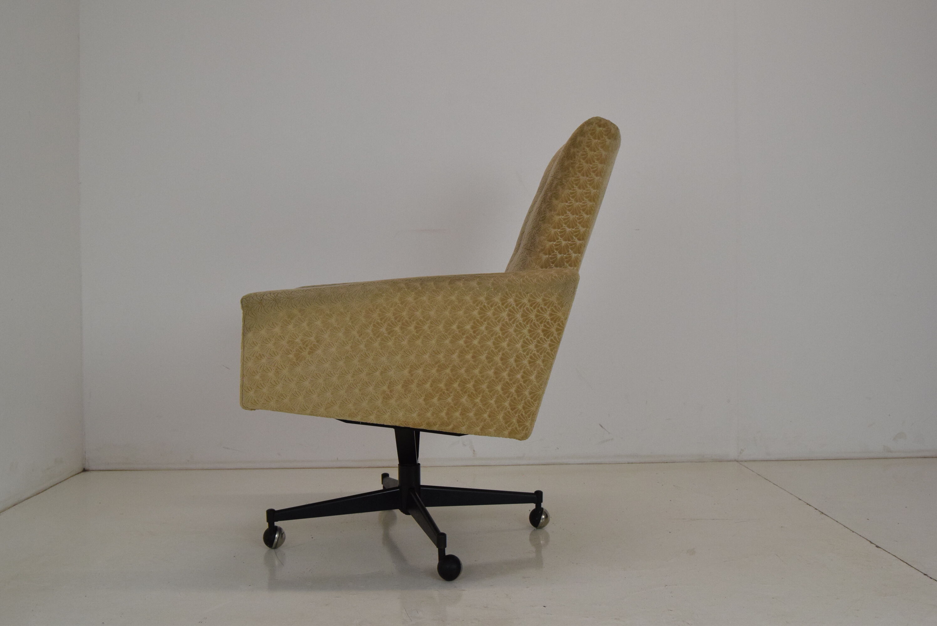 Mid-century swivel armchair with wheels 1970's