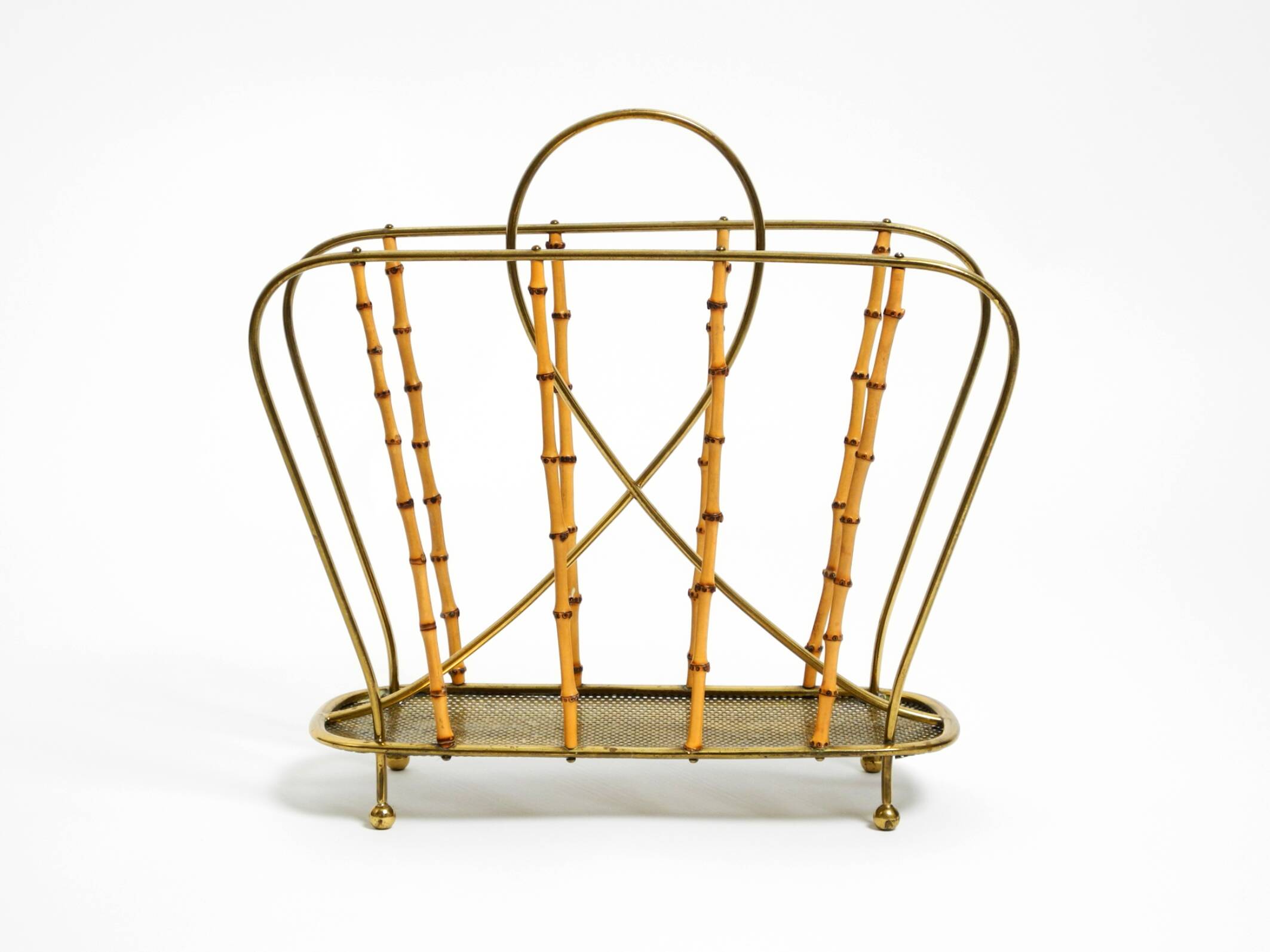 Rare Mid Century Modern magazine rack made of solid brass and genuine bambo