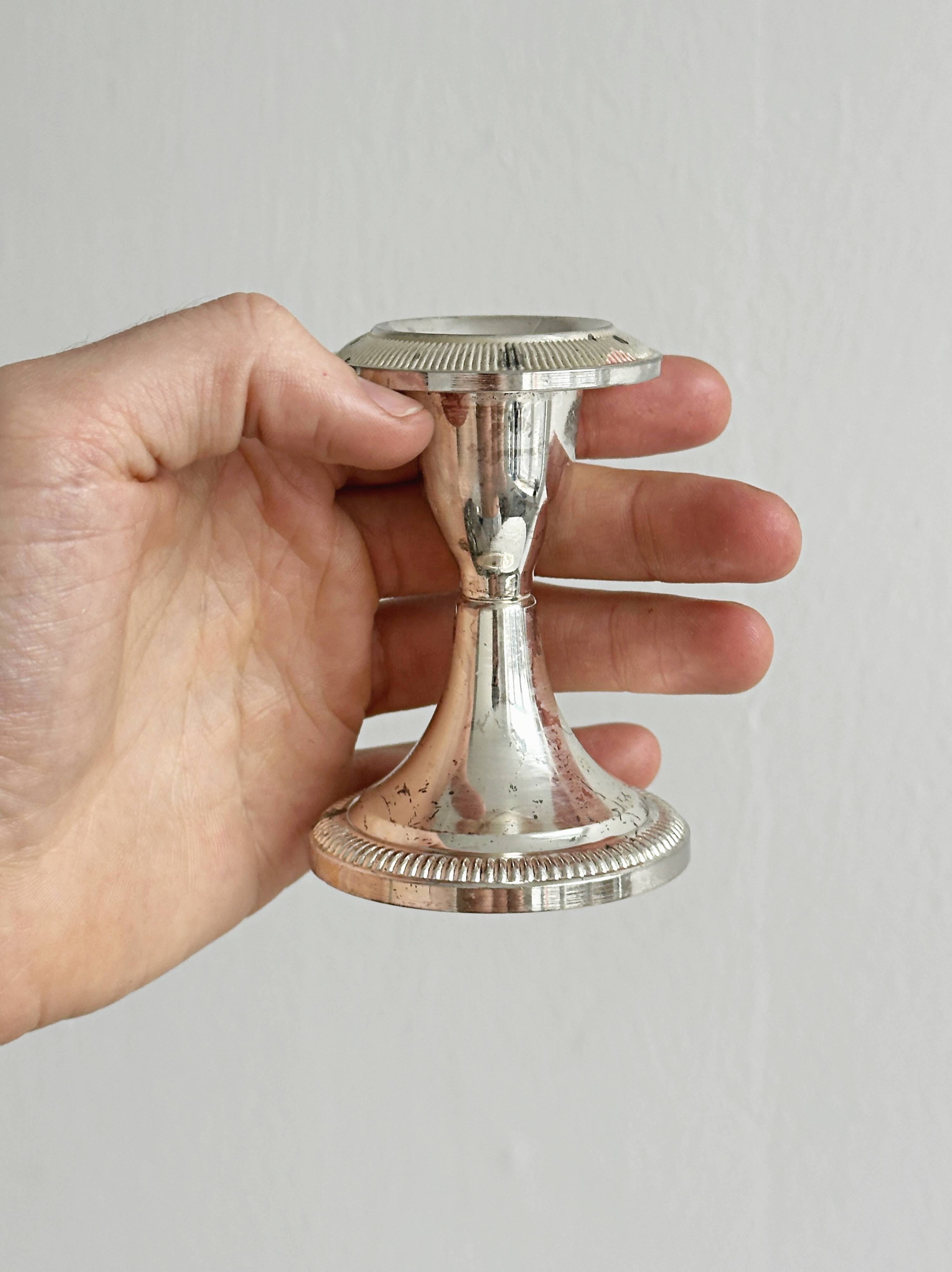 Set of 2 vintage silver-plated metal candle holders.