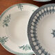 A deep plate in blue and green ironstone, antique French earthenware.