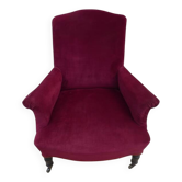 Blackened wooden bergère on wheels, Napoleon III period, upholstered in velvet.
