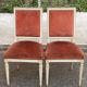 2 Louis XVI chairs in solid wood and orange velvet.
