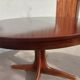 round/oval table with extension, central leg, dark shade, Baumann design