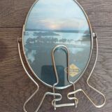 Vintage oval mirror on suspended stand