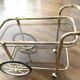 Brass and smoked glass bar trolley, 2 trays