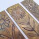 Six cleanliness plaques, flower design, brass.