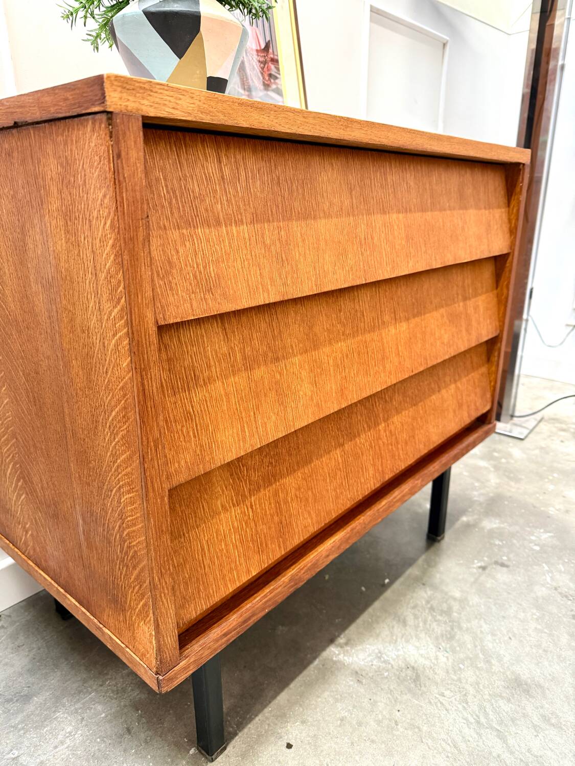 Modernist chest of drawers with slanted drawers