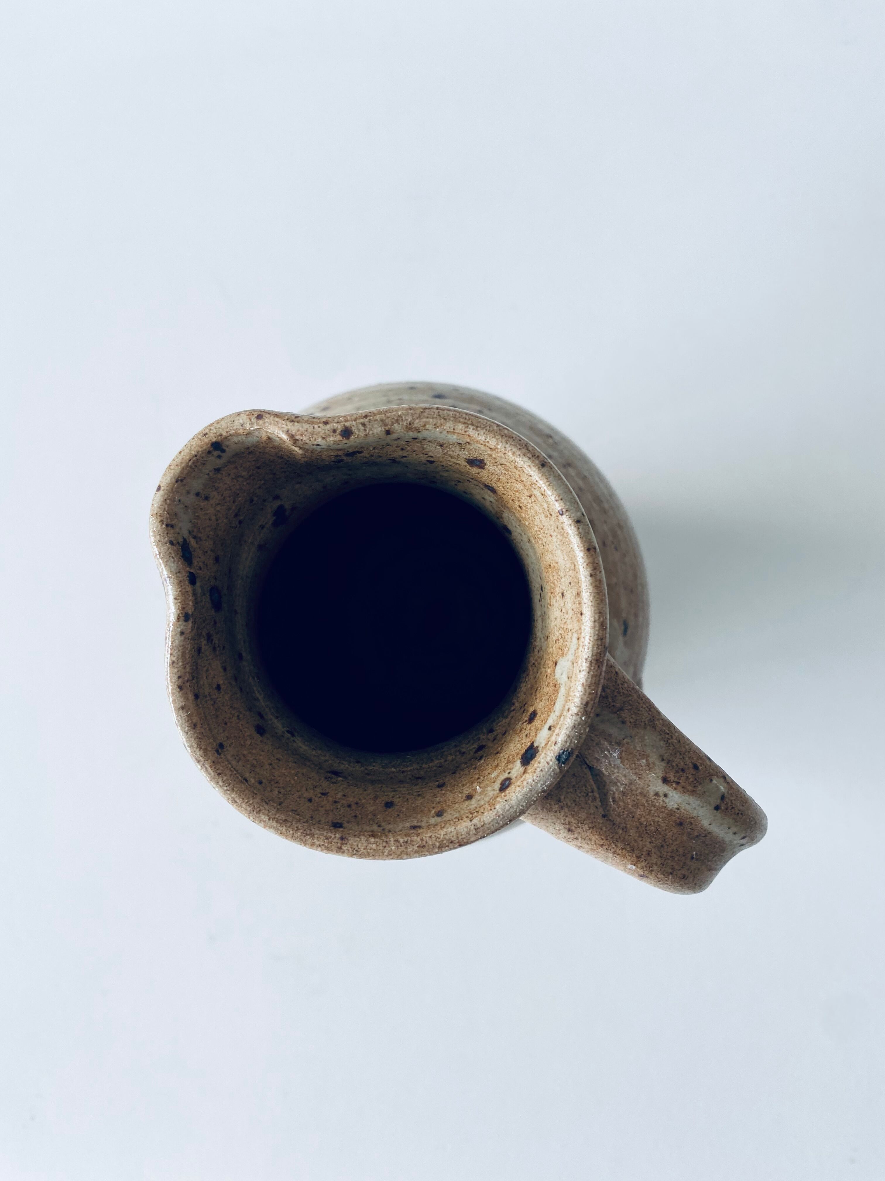Pitcher in sandstone pyrity signed