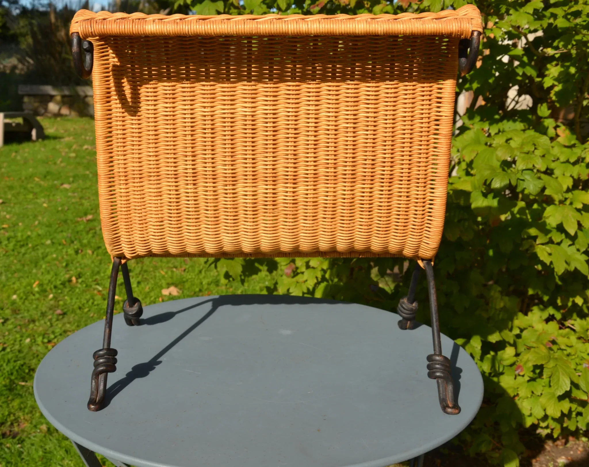 Wrought iron and rattan magazine/newspaper rack