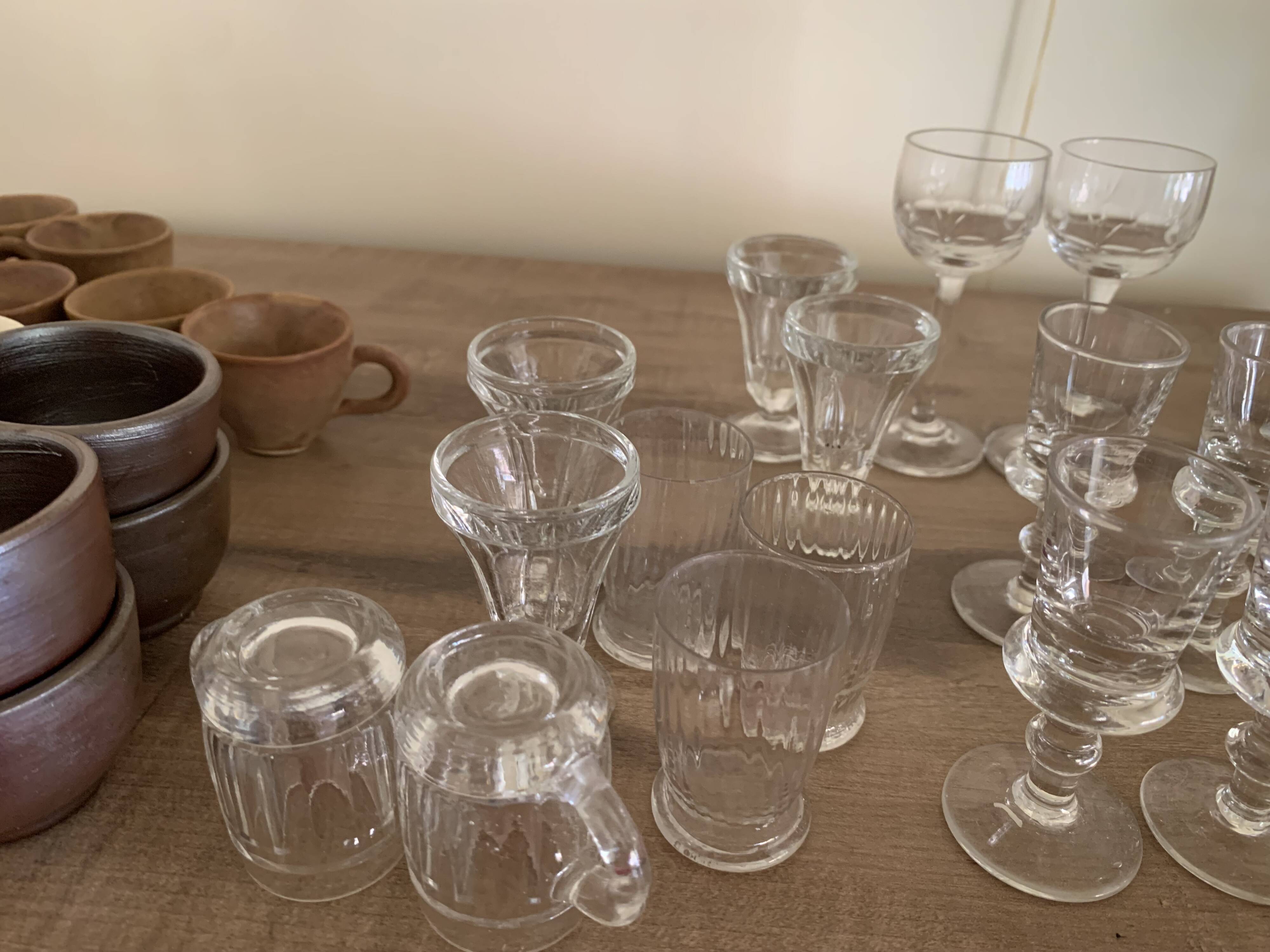 Set of 21 small liqueur glasses and 16 small cups and ramekins.