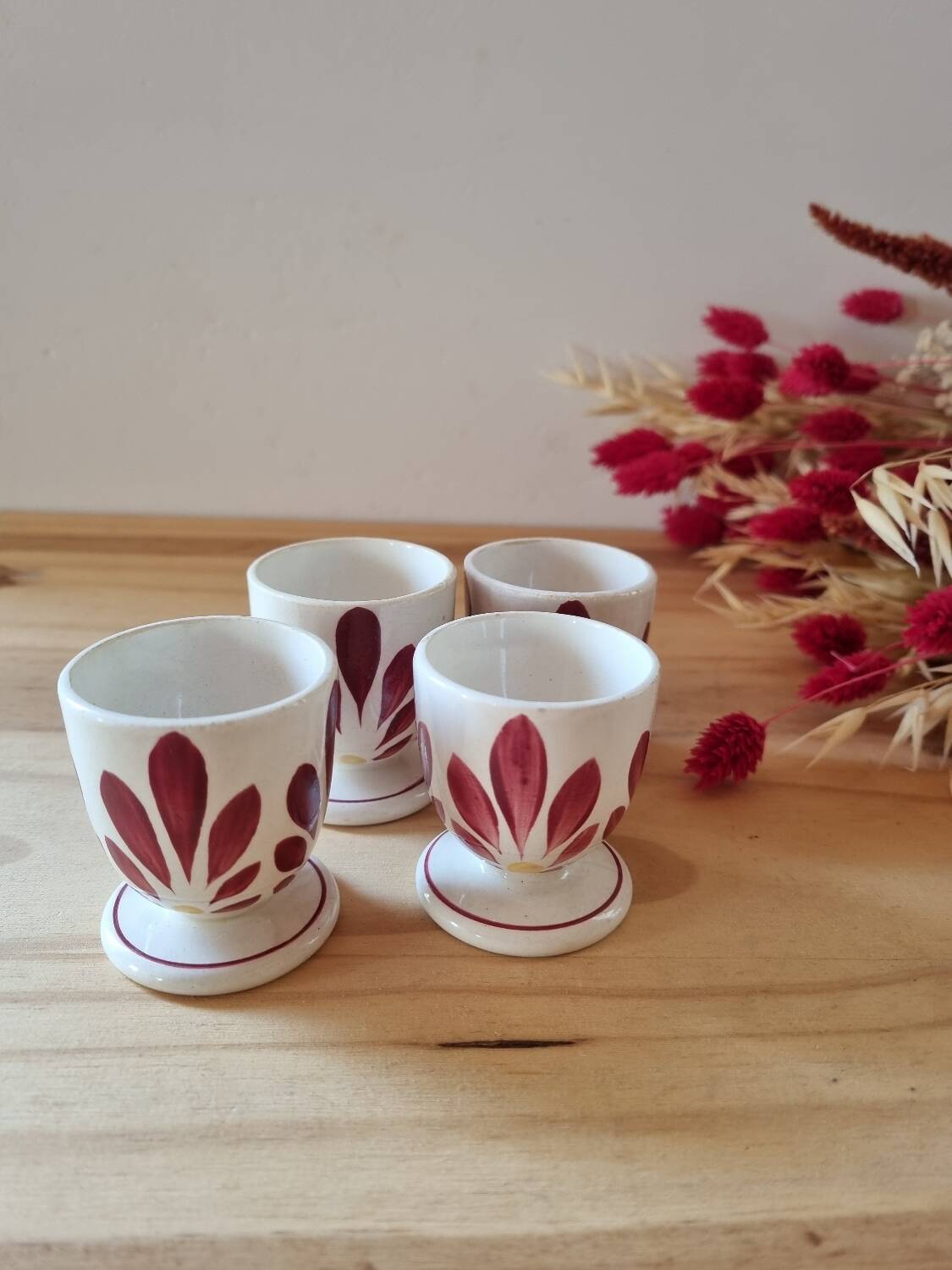 Set of four Digoin-style egg cups