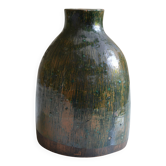 Ceramic vase with a signature fish to identify.