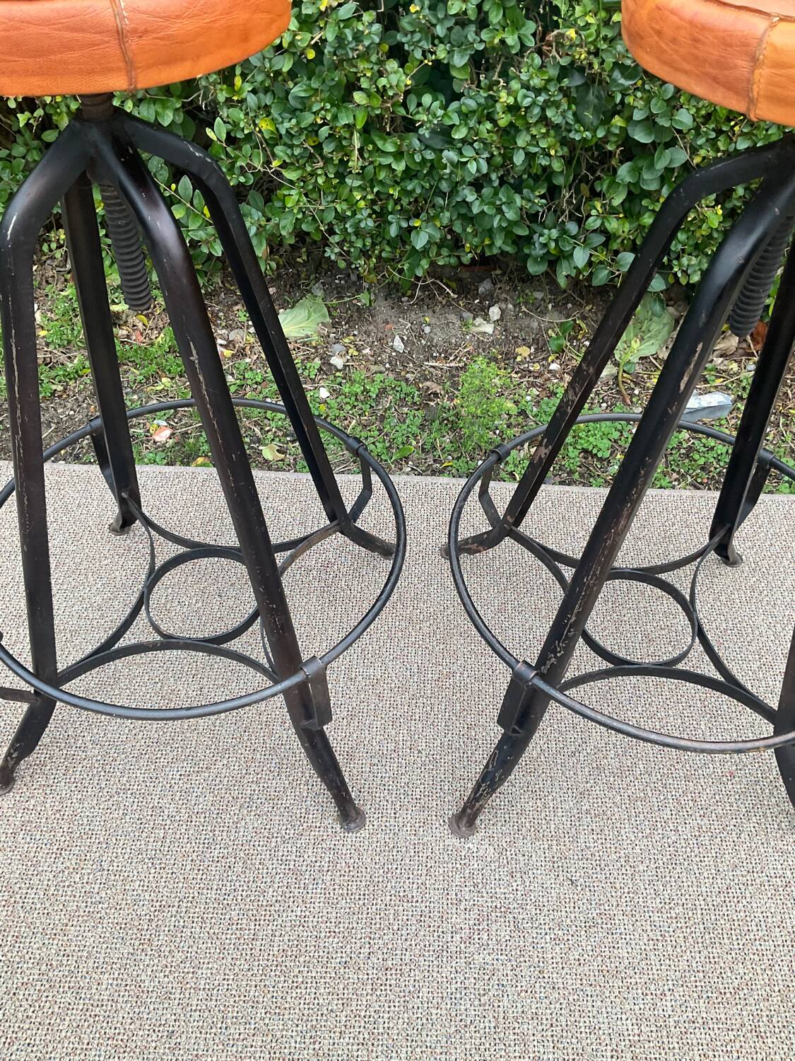 Pair of vintage metal and leather bar stools