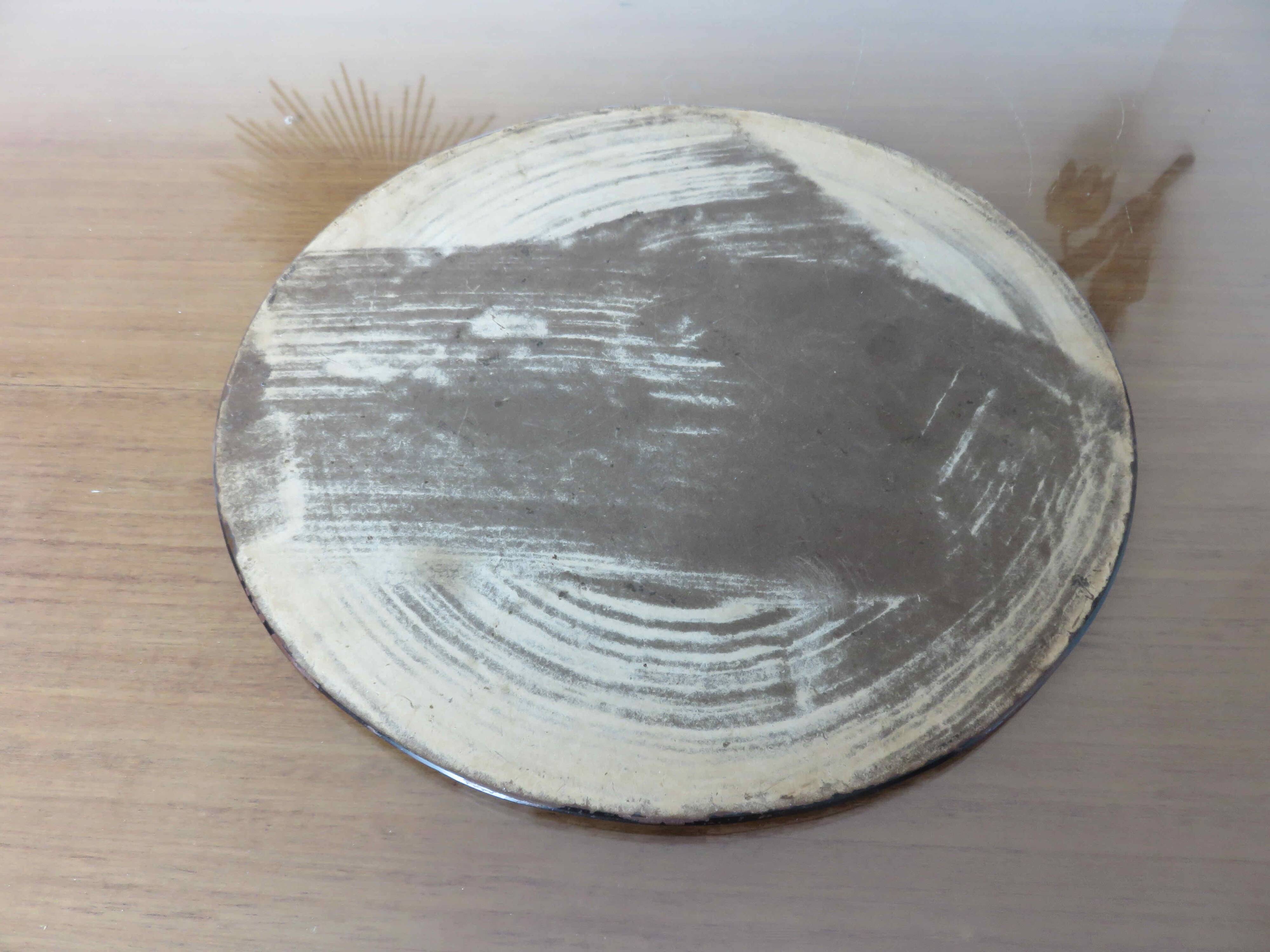 Round beveled amber pink mirror