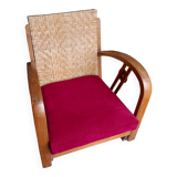 Ancien fauteuil bas colonial style Art Déco en bois.