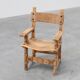 Brutalist armchair with carved rosettes and nailed wooden seat, Spain