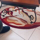 Coffee table in cherry wood with a wrought iron base.